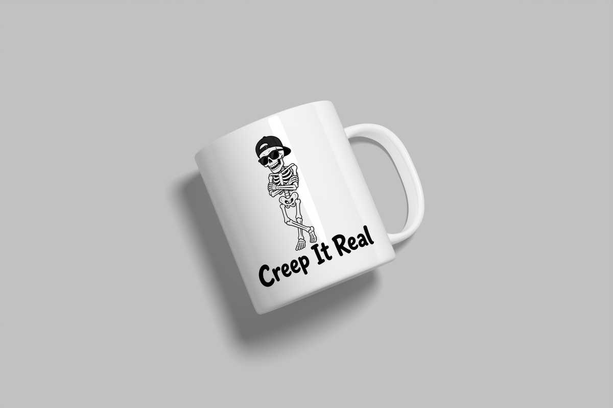 Creep It Real funny mug, white 11oz ceramic novelty gift, angled side view