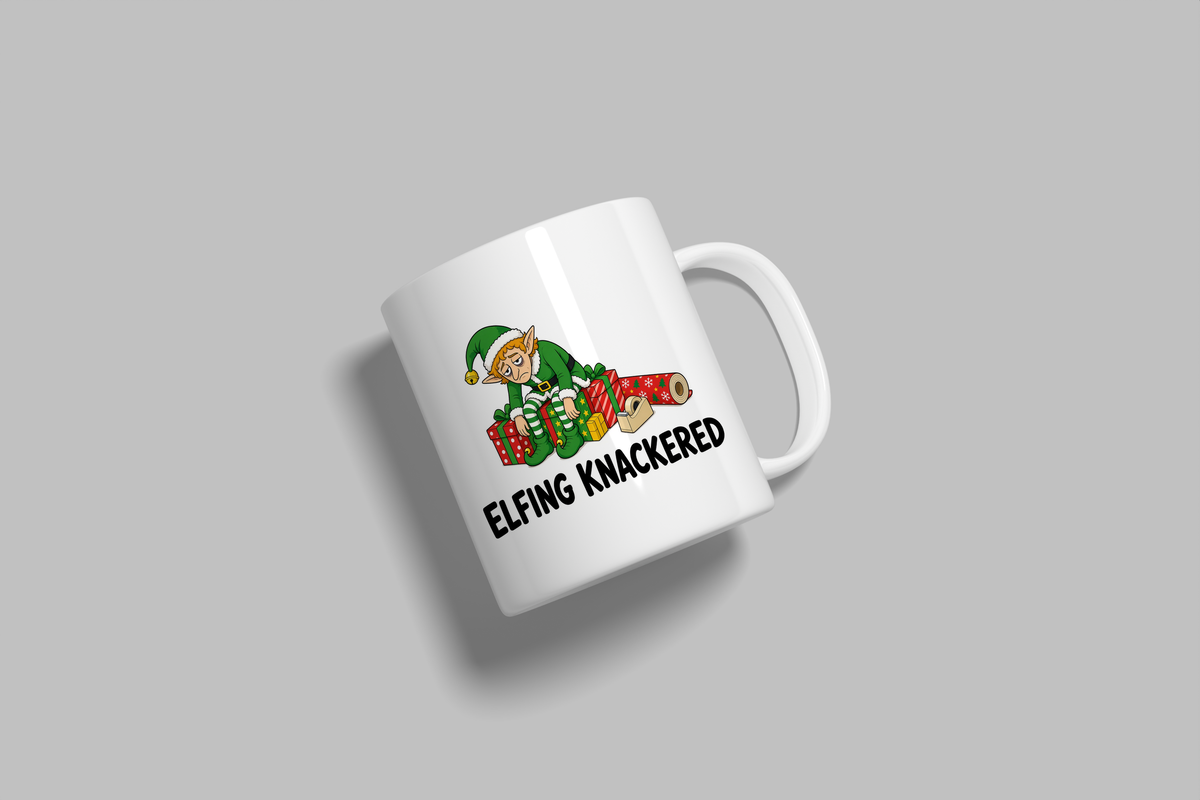 Elfing Knackered funny mug, white 11oz ceramic novelty gift, angled side view