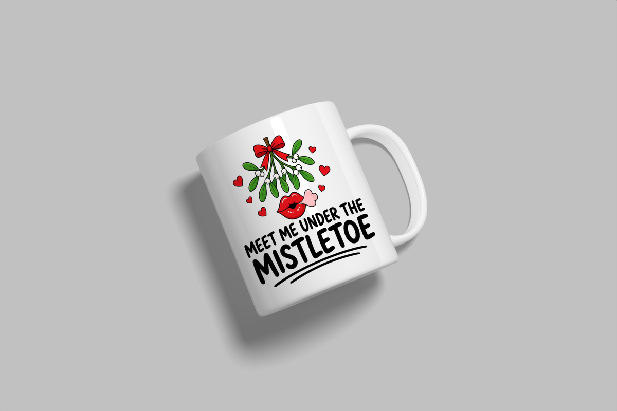 Meet Me Under The Mistletoe funny mug, white 11oz ceramic novelty gift, angled side view