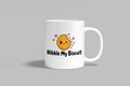 Nibble My Biscuit funny mug, white 11oz ceramic novelty gift, front view