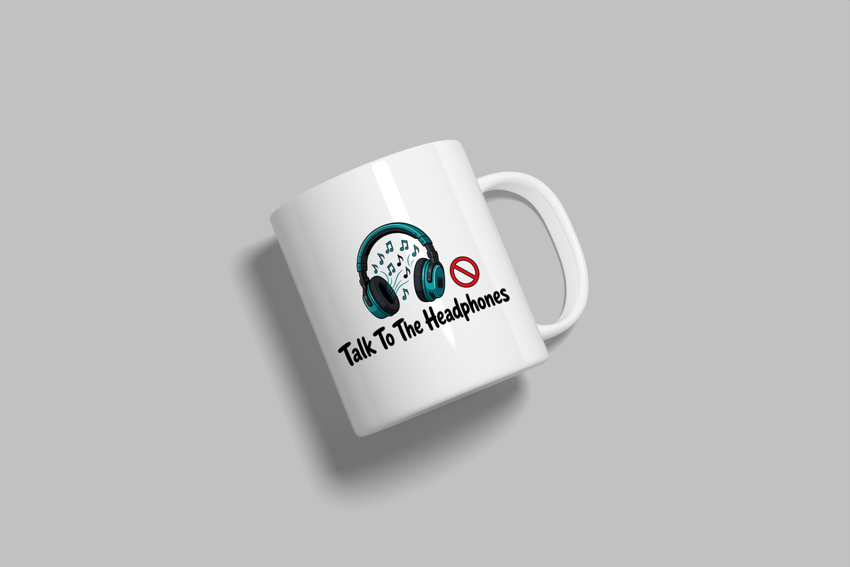 Talk To The Headphones funny mug, white 11oz ceramic novelty gift, angled side view