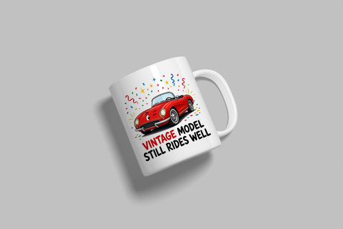 Vintage Model, Still Rides Well funny mug, white 11oz ceramic novelty gift, angled side view